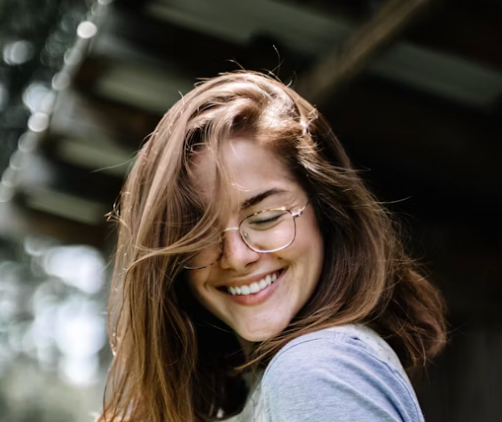 Smiling woman wearing trendy eyewear